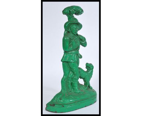 A 19th Century Victorian painted cast iron door stop, modelled as a woodsman smoking his pipe whilst with his dog.