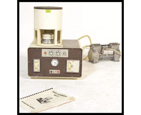 A vintage retro Dental Eurotherm Docx Automatic MK II ceramic dental furnace together with instruction booklet and vacume pum