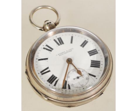 A silver hallmarked large pocket watch having a white enamel face with Roman numeral chapter ring and gilt faceted hands. The