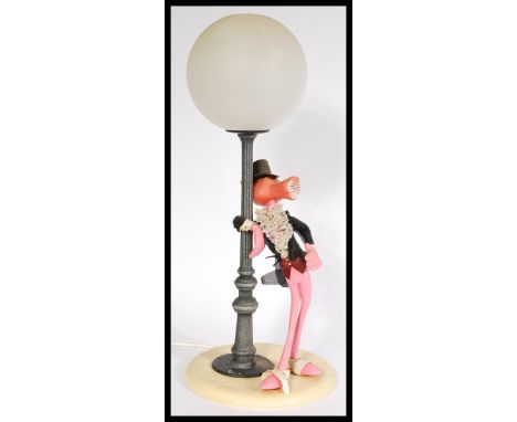 A vintage retro 20th century Pink Panther novelty lamp depicting the iconic character leaning on a lamp post in dinner wear w