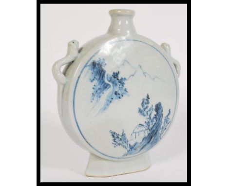 A 19th century Chinese blue and white vase of moon flask shape having hand painted details.&nbsp;measures: 20 cm high x 16 cm