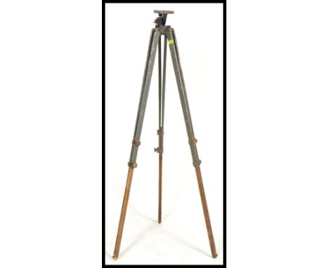A vintage retro 20th century Military tripod having folding adjustable legs with brass mounts. Please see images. Measures 16