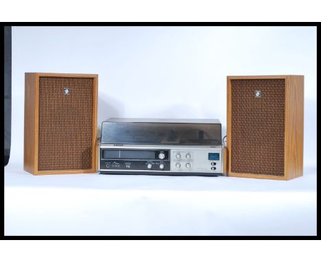 A retro 20th Century Sanyo Stereo Music System Model GXT 4520 KL, having tape p[layer / recorder, record deck and tuner, in a