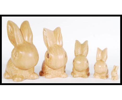 A group of 20th century ceramic SylvaC graduating rabbit figurines with a matte brown glaze, biggest numbered 1026.&nbsp;Meas