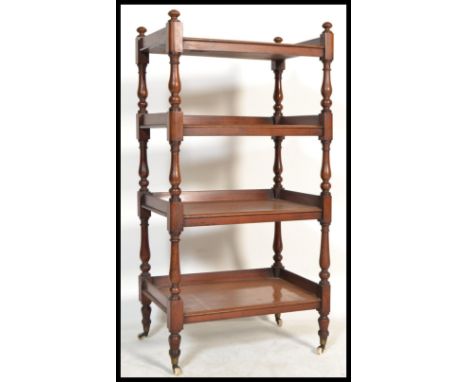 A 19th century Victorian mahogany four tier buffet ( whatnot / etargere )&nbsp; supported on vase shaped turned columns and s