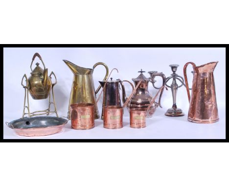 A group of vintage metal ware to include a set of graduating copper measuring pans with applied milk labels. Also included si