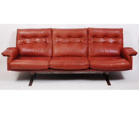 Frederick A Kaiser for Vatna - A 1960s brown leather three seater sofa, raised on curved steel base, w.220cm   Condition Repo