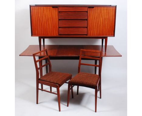 A 1960s teak dining suite by Richard Hornby, comprising; dining table with pull-out action and single drop-in leaf, h.73.5cm,