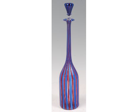 A 1970s/80s Italian glass decanter and stopped by Venini, of elongated form, with red and blue vertical cane decoration (lack
