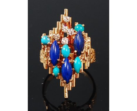 A modern 18ct gold, lapis lazuli, turquoise and diamond set ring, the tiered stones in an abstract lozenge setting, size R   