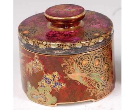 A 1930s Carltonware Paradise Bird, Tree & Cloud pattern pottery jar and cover, of circular form, typically bright colour deco