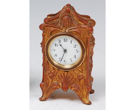 An Art Nouveau German Wurttenberg gilt bronze cased bedside alarm clock, the elaborate case decorated with opposing female bu