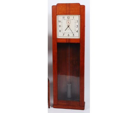 An Art Deco oak IBM International synchromatic electric droptrunk wall clock, of good size, having square enamel dial with in