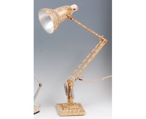 A Herbert Terry cream painted and gilt splash decorated anglepoise desk lamp, having typical hinged and rotating action, prin