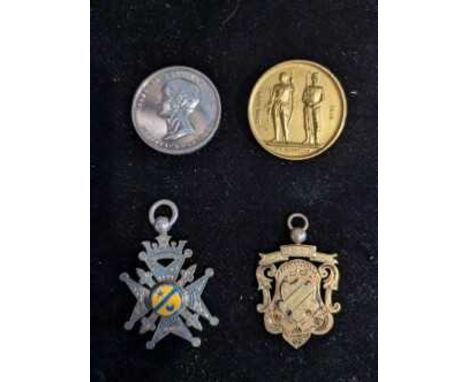 NATIONAL RIFLE ASSOCIATION GILT METAL REVOLVER MEDAL, ALONG WITH THREE FURTHER MEDALS the first with brooch pin attachment ve