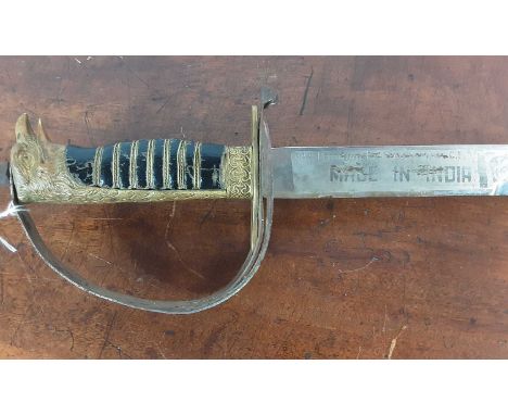 DRESS SWORD, ALONG WITH ANOTHER SWORD the first with curved fullered chromed blade over a brass guard and wire bound leather 