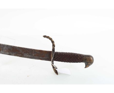 SABRE, EARLY TO MID 19TH CENTURY with curved steel blade, brass intertwined snake guard over a chequered hardwood grip, eagle