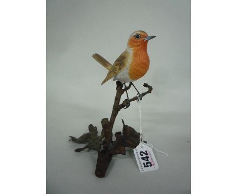 AN ALBANY WORCESTER PORCELAIN BIRD 'ROBIN', perched on metal branches