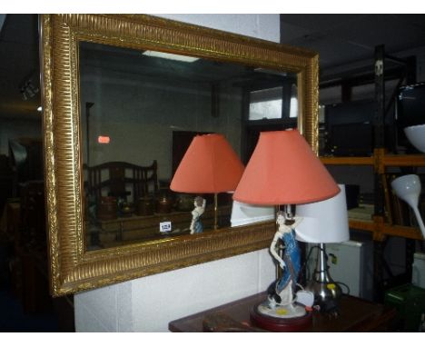 A GILT FRAMED WALL MIRROR, Alba record player, mahogany magazine rack, four table lamps with shades and a floor standing upli