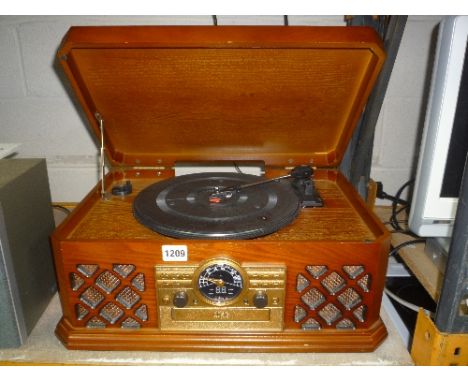 A 'ZENNOX' MODEL D3939 COMBINATION RECORD PLAYER, CD AND RADIO