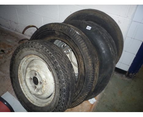 FIVE VINTAGE WHEELS AND TYRES