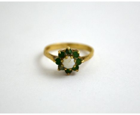 A 9CT GOLD DIAMOND RING, with central opal within a surround of emeralds, hallmarks for London, ring size M