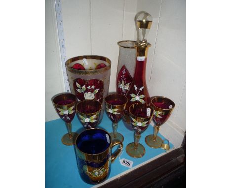 A RUBY COLOURED GLASS DECANTER AND FIVE GLASSES, enamelled with flowers, together with similar items (9)