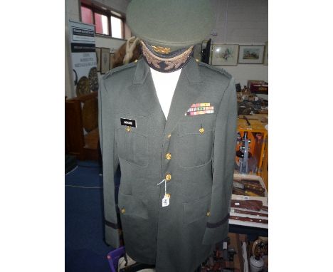 A GREEN US ARMY (STYLE) UNIFORM AND CAP, with cap badges
