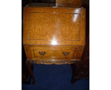 A LADIES WALNUT WRITING BUREAU, and a circular tilt top tripod table (2)