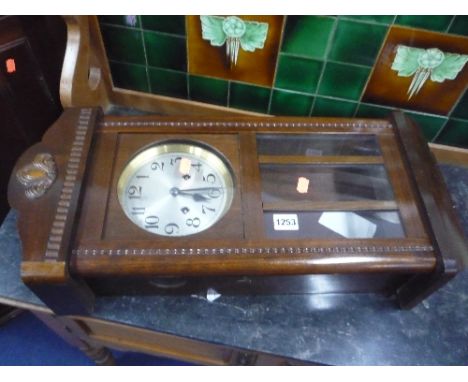 A MAHOGANY CASED WALL CLOCK (key and pendulum)