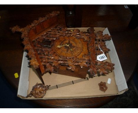 A BLACK FOREST STYLE CUCKOO CLOCK