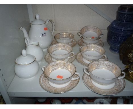 A ROYAL DOULTON 'SIGNATURE GOLD' tea service (3) and 'Sovereign' cream soups and stands (13)