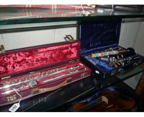 A CASED YAMAHA FLUTE, 'YFL215' and a cased Buffet clarinet (2)