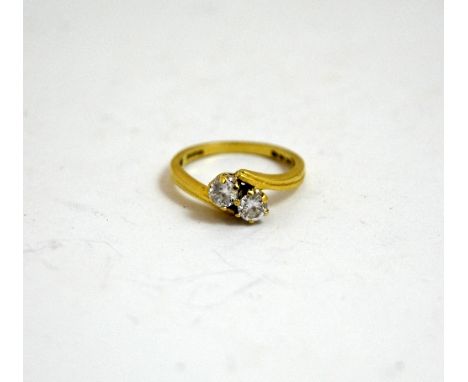 A 9CT GOLD CUBIC ZIRCONIA RING, with two brilliant-cut diamonds on a twisted plain shank, ring size K 1/2