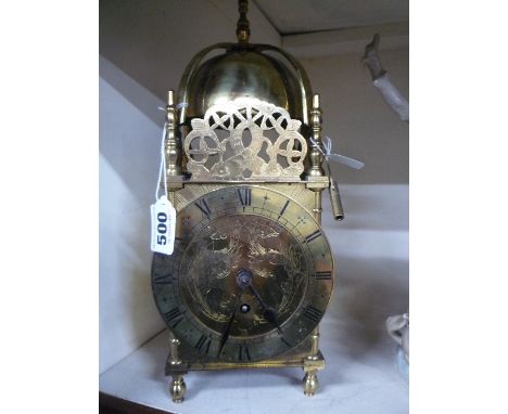 A BRASS LANTERN CLOCK, Swiss made Buren movement, with key