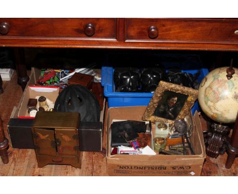 Carved tribal heads and pole stand, globe, lighters, die-cast toy cars, Oriental lacquered four drawer cabinet, metalwares, e