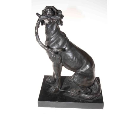 Bronze sculpture of working dog with stick on marble plinth.