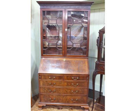 Georgian mahogany bureau bookcase having two astragal glazed panel doors above a fall front with two short and three long dra