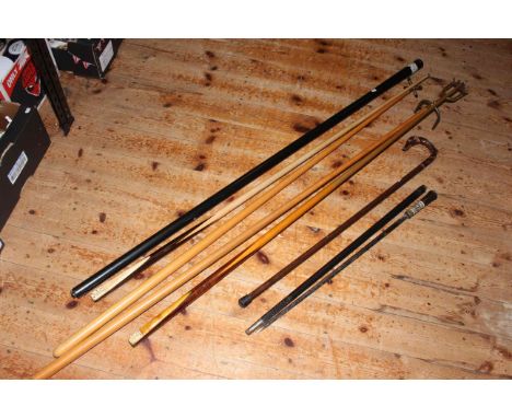 Indian sword stick with ornate handle, dog carved walking cane, vintage snooker cue made by Burnley Billiard Works and a Joe 
