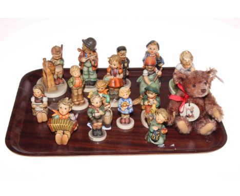 Collection of fifteen Hummel figures and Steiff teddy.