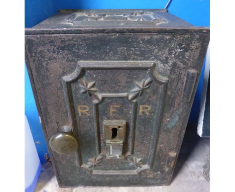 A Vintage Metal Safe marked R F R to the front and having decoration to the top and door, approx. 32 x 29 x 44 cms. ( with ke