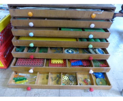 A Miscellaneous Quantity of Vintage Meccano, the six drawer cabinet containing plates, wheels, gears of various sizes togethe