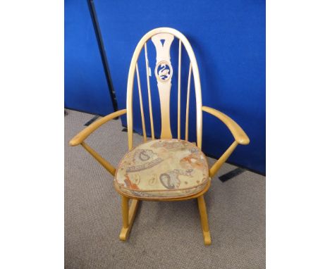 A Light Beech Ercol Swan Back Rocking Chair.