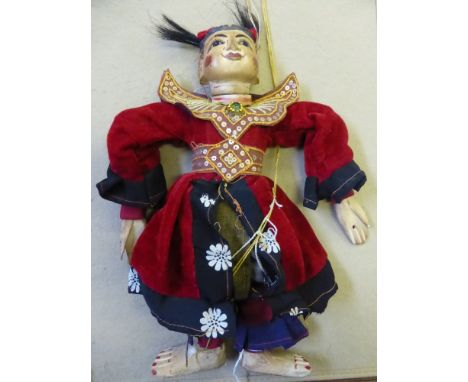 Three Oriental Wooden Hand Painted Puppets, each puppet in traditional costume, possibly Indonesian.