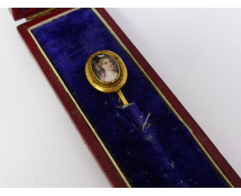 A Gentleman's Antique Gold Hand Painted Porcelain Tie Pin. The tie pin depicting a young lady.
