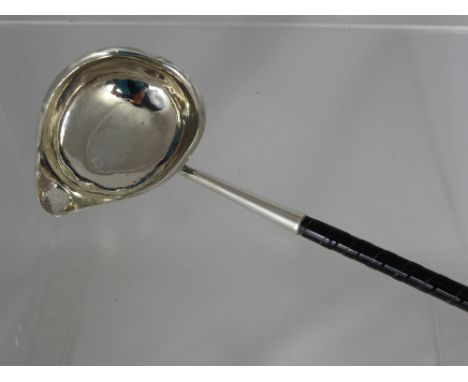 A George III Silver Brandy Ladle, having a pouring bowl, London hallmark dated 1782, m.m rubbed, monogram FAB to the bowl.