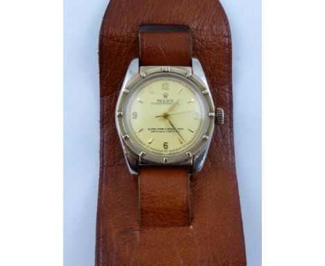 A Gentleman's Stainless Steel Vintage Part Rolex wristwatch,  The watch having a gold plated bezel with numerals and baton di