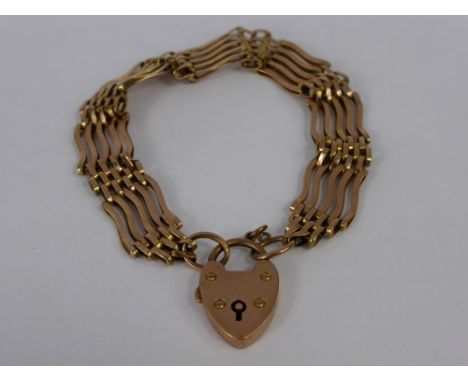 A 9 ct Rose Gold Hallmark Gate Link Bracelet. The bracelet having a heart form clasp, approx 19.5 gms.