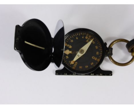 A German Military WWII Compass & Strap, stamped NEAG (Norddeutsche Elektro Akustik Gesellschaft) Berlin Germany.