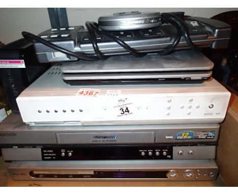 Shelf of mixed electricals to include video players and DVD players 